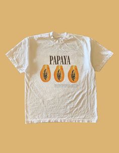 This Retro-Style Vintage Unisex T-Shirt is the perfect addition to your streetwear collection. This shirt features a vibrant and eye-catching Papaya Graphic, making it a must-have for both women and men with a love for unique and stylish clothing. Sizing reference ~ The Graphic Tees are true to size and are not oversized, please refer to the size guide that is attached as a photo on each post. For an oversized look, choose a size up ️ 🪩 Shipped from Australia for speedy delivery  T&C's - Please Fruit Clothes, Streetwear Collection, White Graphic Tee, Oversized Look, Vintage Graphic Tee, Vintage Graphic, Summer Fit, Vintage Graphics, Oversized Shirt