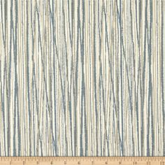 a blue and white striped wallpaper with vertical stripes on the bottom half of it