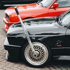 a scooter is parked next to some cars