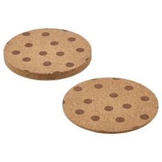 two cork coasters with brown dots on them