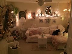 a living room filled with furniture and christmas lights