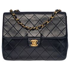 Gorgeous Chanel Mini Timeless Flap bag in navy blue quilted lambskin, gold metal hardware, gold metal chain interwoven with navy leather for a shoulder and shoulder strap Backpack pocket Flap closure, gold-tone CC clasp Single Flap Inner lining in burgundy leather, a double patch pocket, 1 lipstick pocket, a zipped pocket Signature: "Chanel ®Made in France” Date: 1989/1991 Dimensions: 20 x 15 x 6 cm (7.9 x 5.9 x 2.36 Inches ) Chain length: 52 cm (20.5 Inches) Reference: 100397 Packaging: Hologram: Yes Authenticity card: Yes Dustbag: No Box: No General condition: 6/10 In good vintage condition despite marks of use on the leather (slight deformation) and hardware Option in addition: Certification of authenticity by a judicial expert and at the Appeal Court of Paris Vintage Chanel, Navy Chanel, Navy Quilt, Chanel Mini, Flap Shoulder Bag, Navy Leather, Metal Hardware, Flap Bag, Chanel Classic