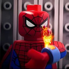 a lego spider - man character holding a glowing item
