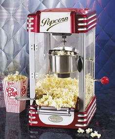 a popcorn machine sitting on top of a table