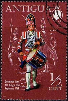 a postage stamp with an image of a man in uniform holding drums and drum sticks