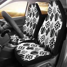 the interior of a car with black and white designs on it, including cactuses