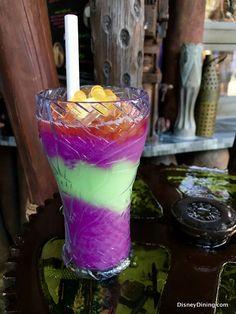 a colorful drink sitting on top of a table