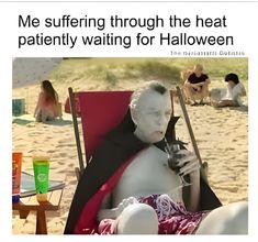 an old man sitting in a lawn chair on the beach with his face painted white