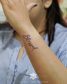 a woman is holding her hand up to her face with the word dear written on it