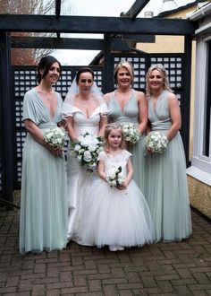 a group of women standing next to each other