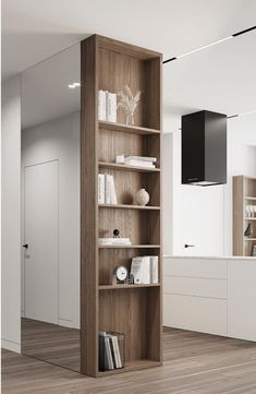 an empty bookcase in the middle of a room