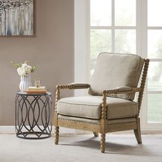 a living room scene with focus on the chair and side table in the foreground