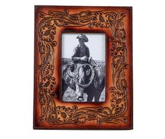 an old photo frame with a cowboy on it