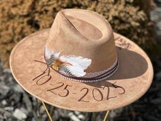 "Wedding Custom hand burned wide brimmed Boho Western Hat made to order just for you.  Colors: Cream Sand (Light Tan) Cognac (Dark Tan) When my dad passed away, I made my mom a hat to commemorate him... with places they've traveled, songs they sung, and things that reminded her of him. I loved it so much, I made myself one with my moms favorite Bible verse, my dads ammo casing and so many things I cherish. When I posted them to my friends, I started getting others wanting a special custom hat. Hand Burn, Western Hat, To My Friends, Step Stool Kids, Cowgirl Hat, Moms Favorite, Western Hats, Cowgirl Hats, Colorful Feathers