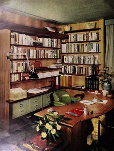 an office with bookshelves, desk and chairs