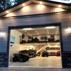 an open garage door with lights on the side and stairs leading up to the second floor