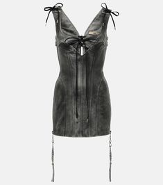 a women's leather corset with laces on the sides and straps