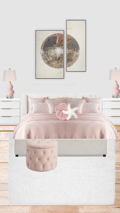 a white bed with pink comforter and two pictures on the wall in front of it