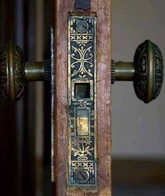 an old door handle with ornate designs on it