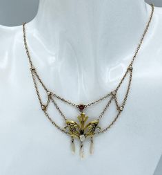 Lovely Art Nouveau 14k, garnet, seed pearl and freshwater pearl swag necklace. Marked 14k on clasp. Measures - 16 inches long, 40.64 cm Center measures - 4 x 1 1/2 inches, 10.16 x 3.81 cm Weight - 4.77 grams. CONDITION: Spring clasp is new. Otherwise in good vintage condition. If you like what you see here please take a moment to check out the other vintage jewelry I have for sale. I combine shipping costs for multiple purchases. Antique Art Nouveau 14k Garnet, Seed Pearl & Freshwater Pearl Swag Art Noveau Jewelry, Art Nouveau Jewelry Vintage, Swag Necklace, Antique Pearl Necklace, Vintage Pearl Jewelry, Art Nouveau Necklaces, Antique Jewelry Necklace, Nouveau Jewelry, Necklace Antique