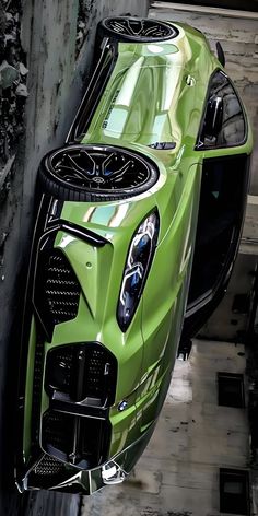 the front end of a green sports car