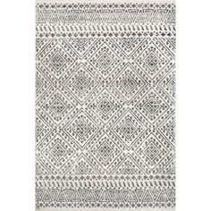 a white and black rug with an intricate design