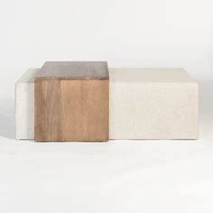 two wooden benches sitting next to each other on top of a white floor covered in carpet