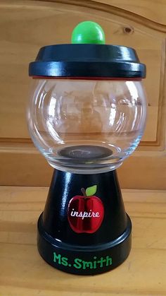 an apple gumper machine sitting on top of a wooden table