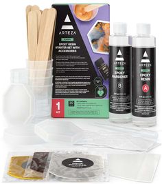 an assortment of craft supplies including sticks, glue and paper