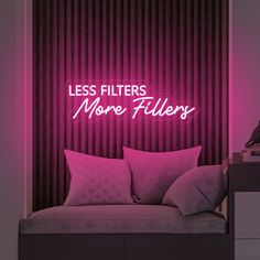 a pink neon sign that says less filters, more fillers on the side of a wall