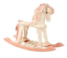 a toy rocking horse with pink flowers on it