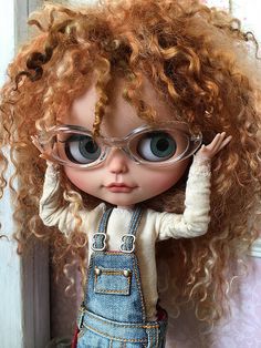 an image of a doll with glasses on