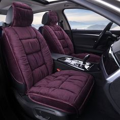 the interior of a car with purple seats
