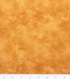 an orange and yellow background with some stains