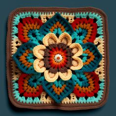 a crocheted square with a flower in the center on a blue background is shown