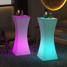 two lighted tables in the middle of a room