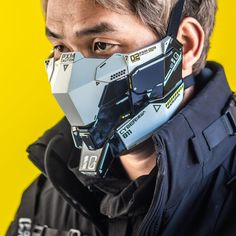 a man wearing a face mask with futuristic designs on it