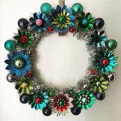 a christmas wreath is hanging on the wall