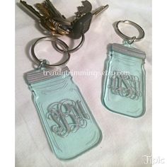 two mason jar keychains with monogrammed initials