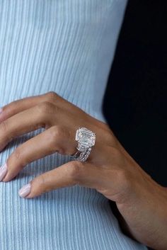 a woman's hand with a ring on her finger