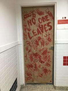 a door with graffiti written on it and no one leaves sign above the door that says do not enter