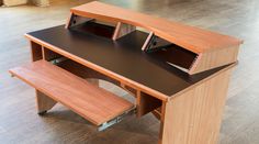 a wooden desk with two shelves and a bench