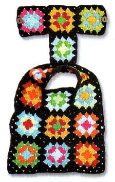 two crocheted bibs with different colors and designs on the front, one is black