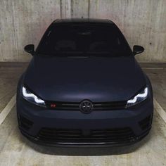 the front end of a dark colored car