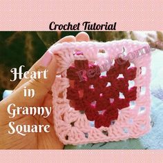 a crochet heart in granny square is being held by someone's hand