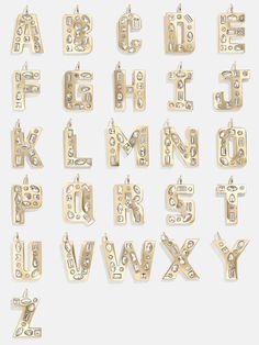 the alphabet is made out of metal and has letters that are cut into different shapes