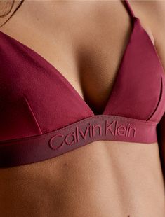 A triangle bikini top made with a minimal look. Designed with adjustable shoulder straps for a personalized fit. Finished with a Calvin Klein logo underband.  Material: 74% Polyamide, 26% Elastane. Calvin Klein, Boxing, Shoulder Strap, Calvin Klein Swimwear, Minimal Look, Motorcycle Outfit, Triangle Bra, Shoulder Straps, Cranberry