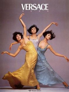 three women in dresses are dancing together with the words versa on top of their heads