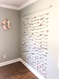 the wall is decorated with butterflies and a wreath hanging on it's back side
