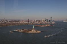 an aerial view of the statue of liberty in new york city